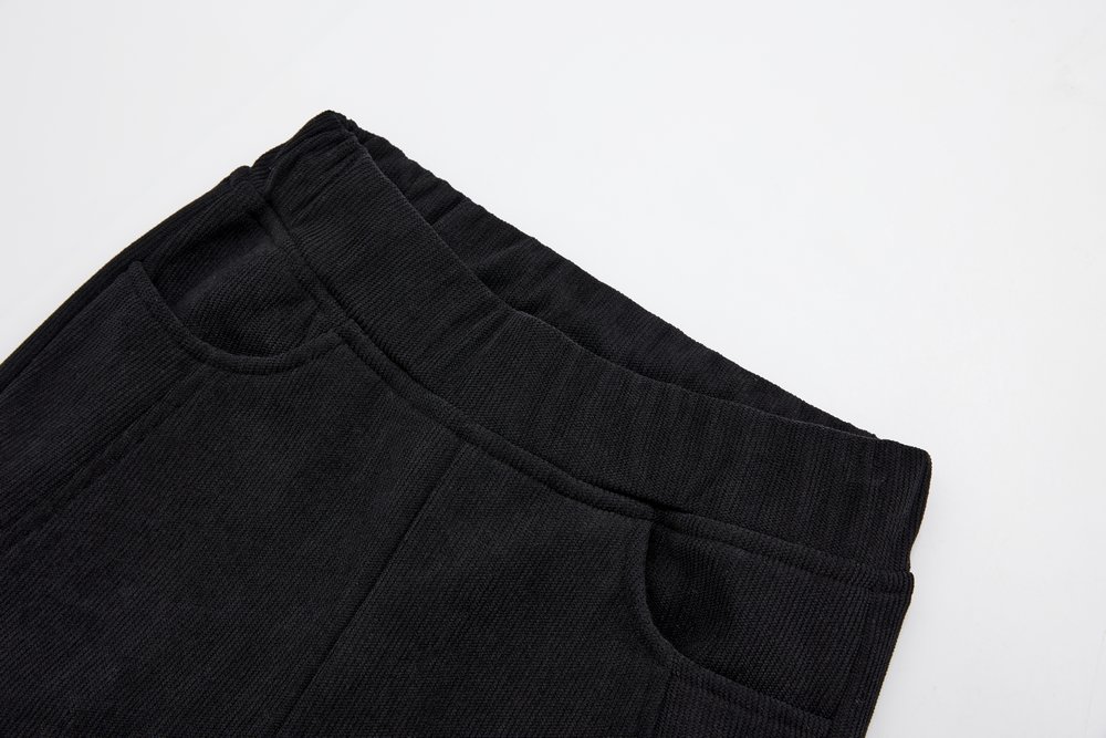 Dívčí ZATEPLENÉ manšestrové kalhoty Wolf T2425 černé s jednorožcem